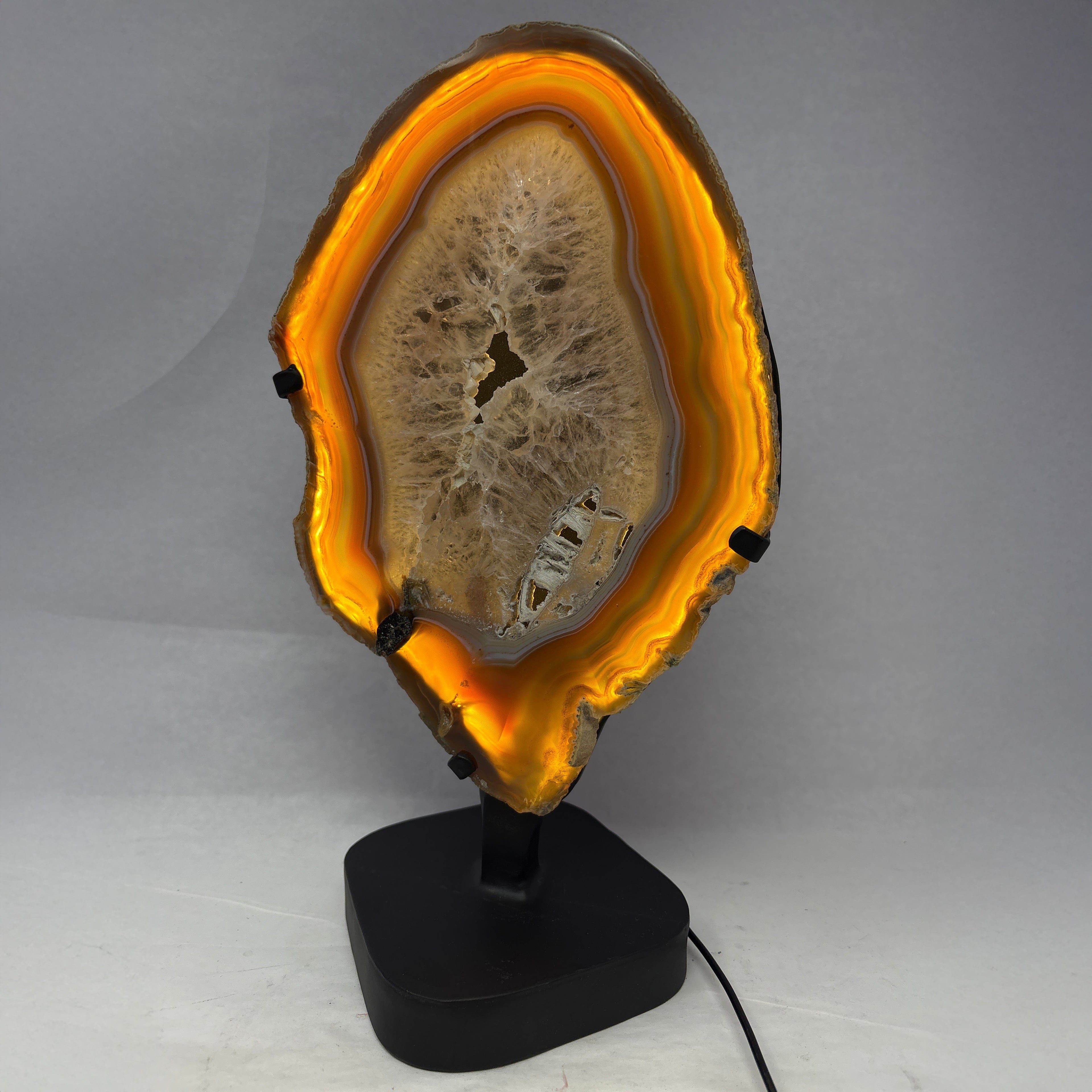 Agate Slice Chocolate with Amethyst Center On Illuminated Table Stand