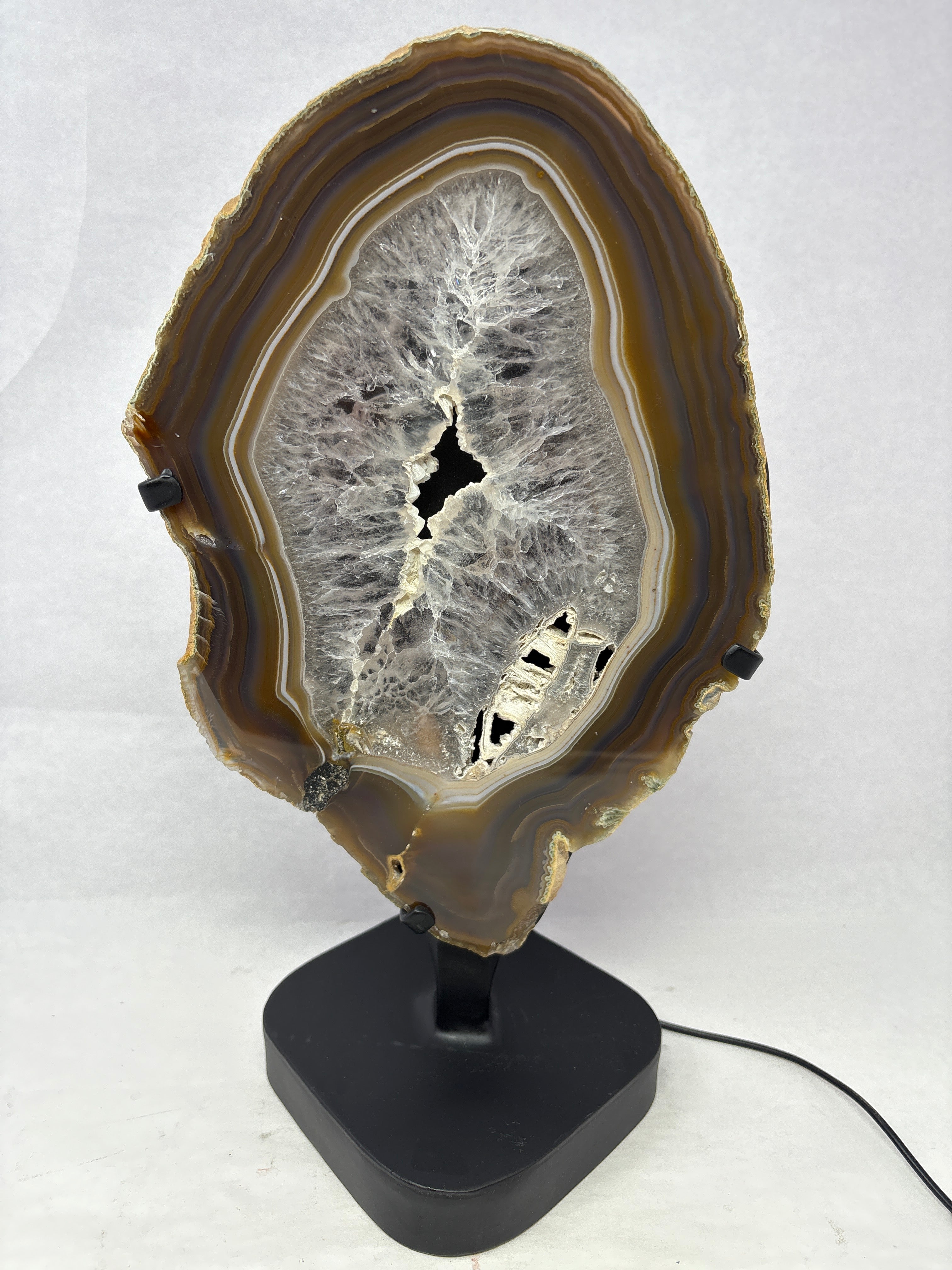 Agate Slice Chocolate with Amethyst Center On Illuminated Table Stand